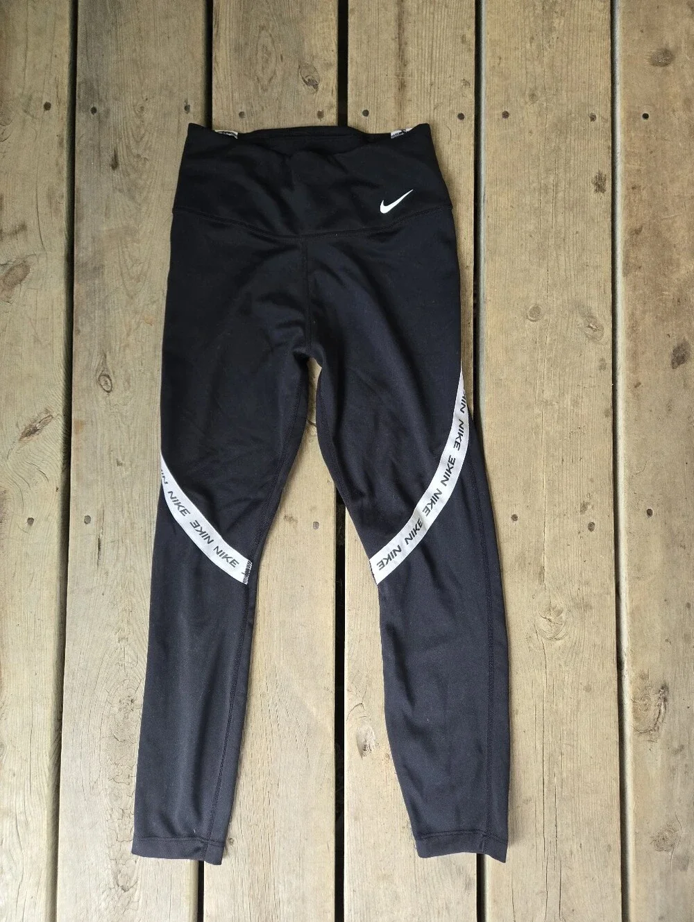 Nike black athletic leggings, w/ the spell out logo, size XS in great condition